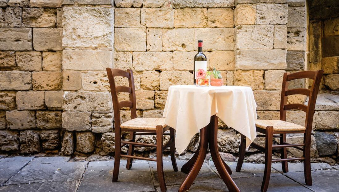 street side dining table with wine